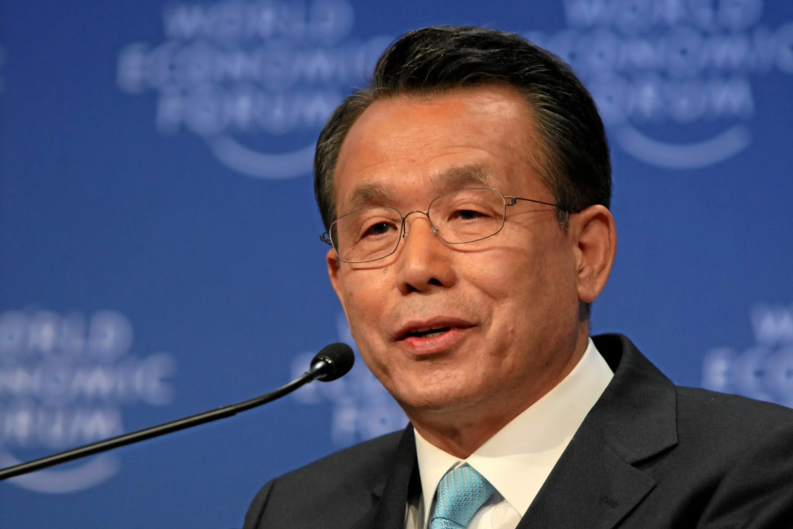Man speaking at World Economic Forum event.